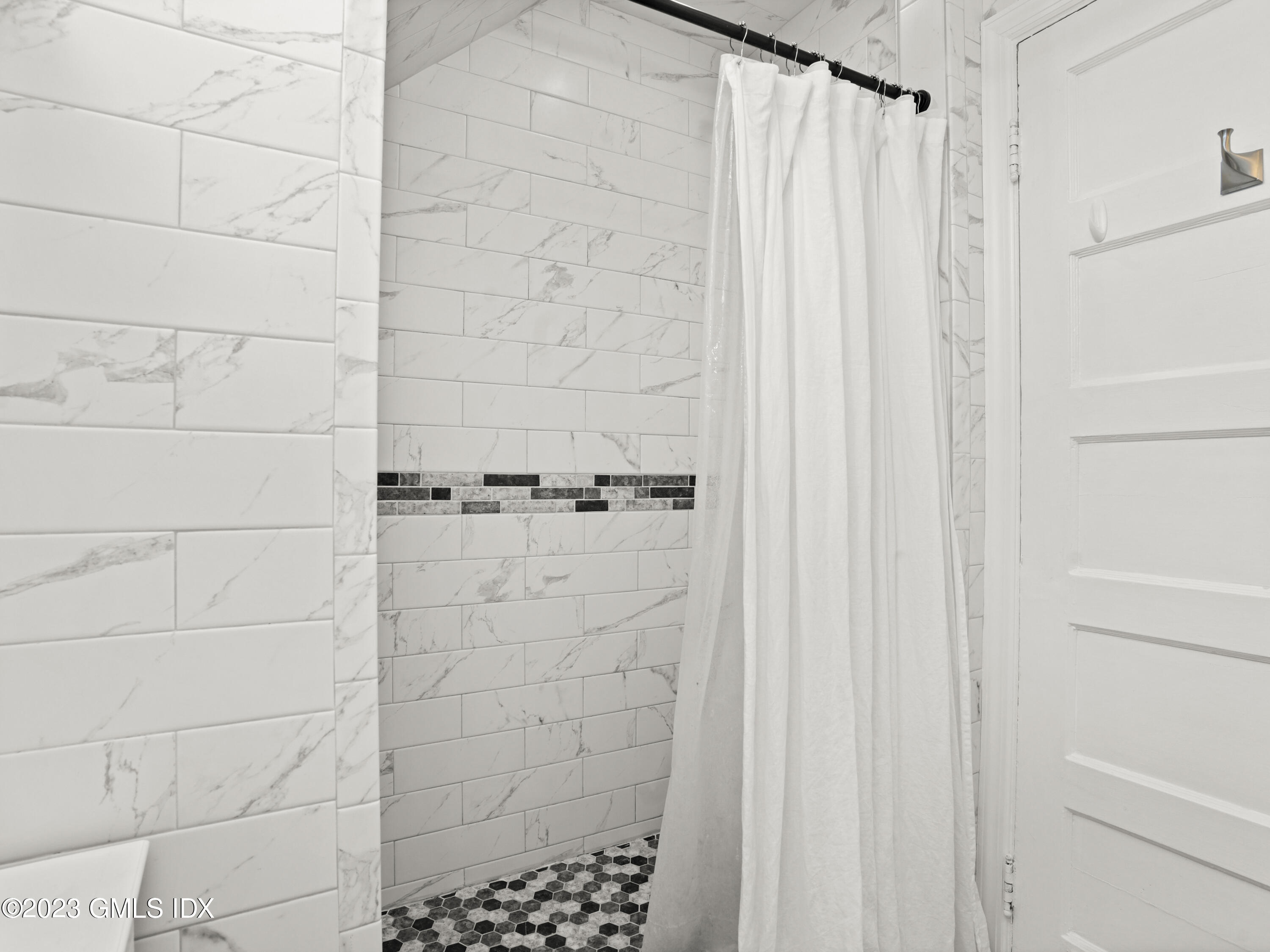 15 Locust Road, Unit COTTAGE Greenwich, CT 06831 - Photo 18 of 25 a bathroom with a shower and a shower curtain