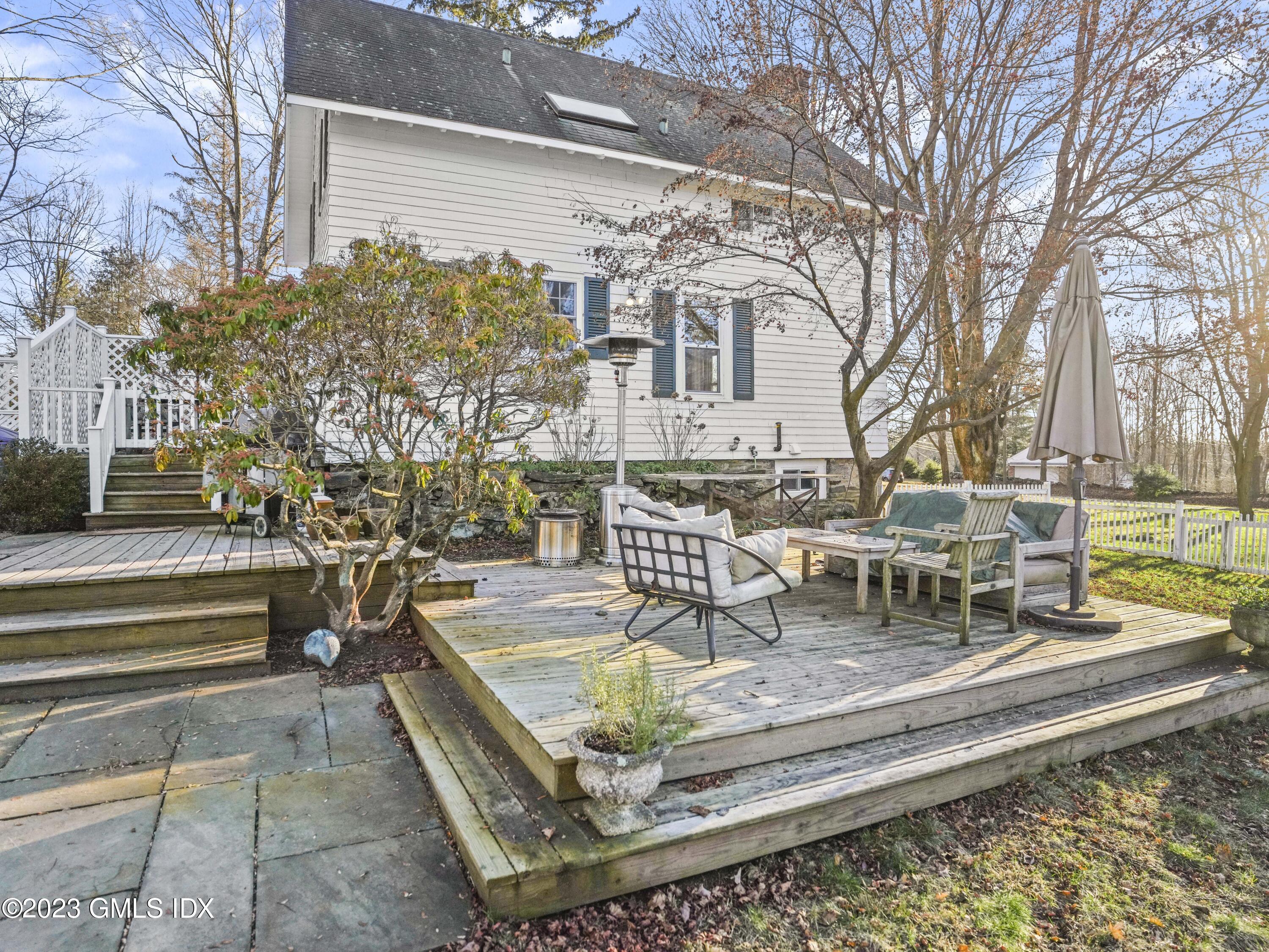 15 Locust Road, Unit COTTAGE Greenwich, CT 06831 - Photo 20 of 25 a view of a swimming pool with a patio