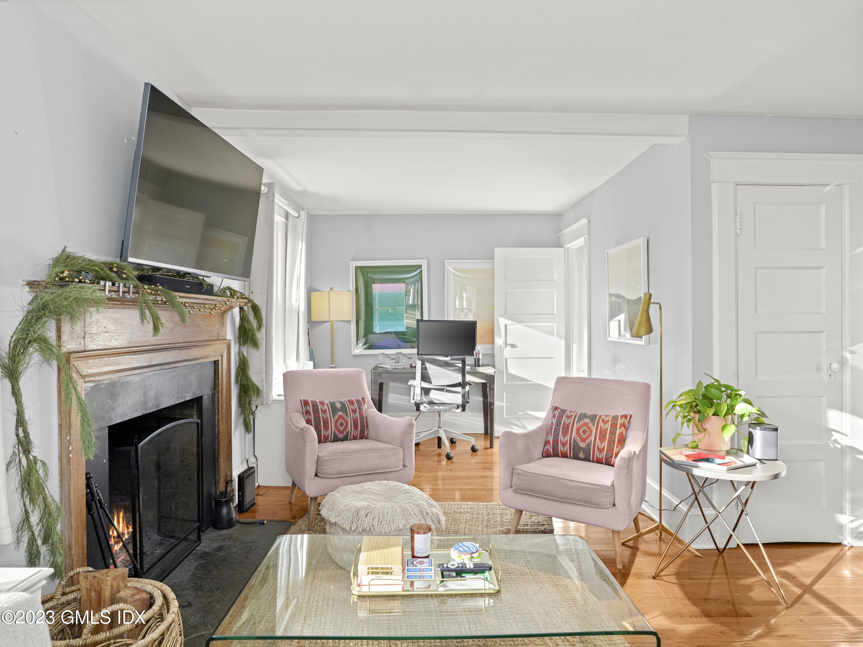 15 Locust Road, Unit COTTAGE Greenwich, CT 06831 - Photo 3 of 25 a living room with furniture and a fireplace