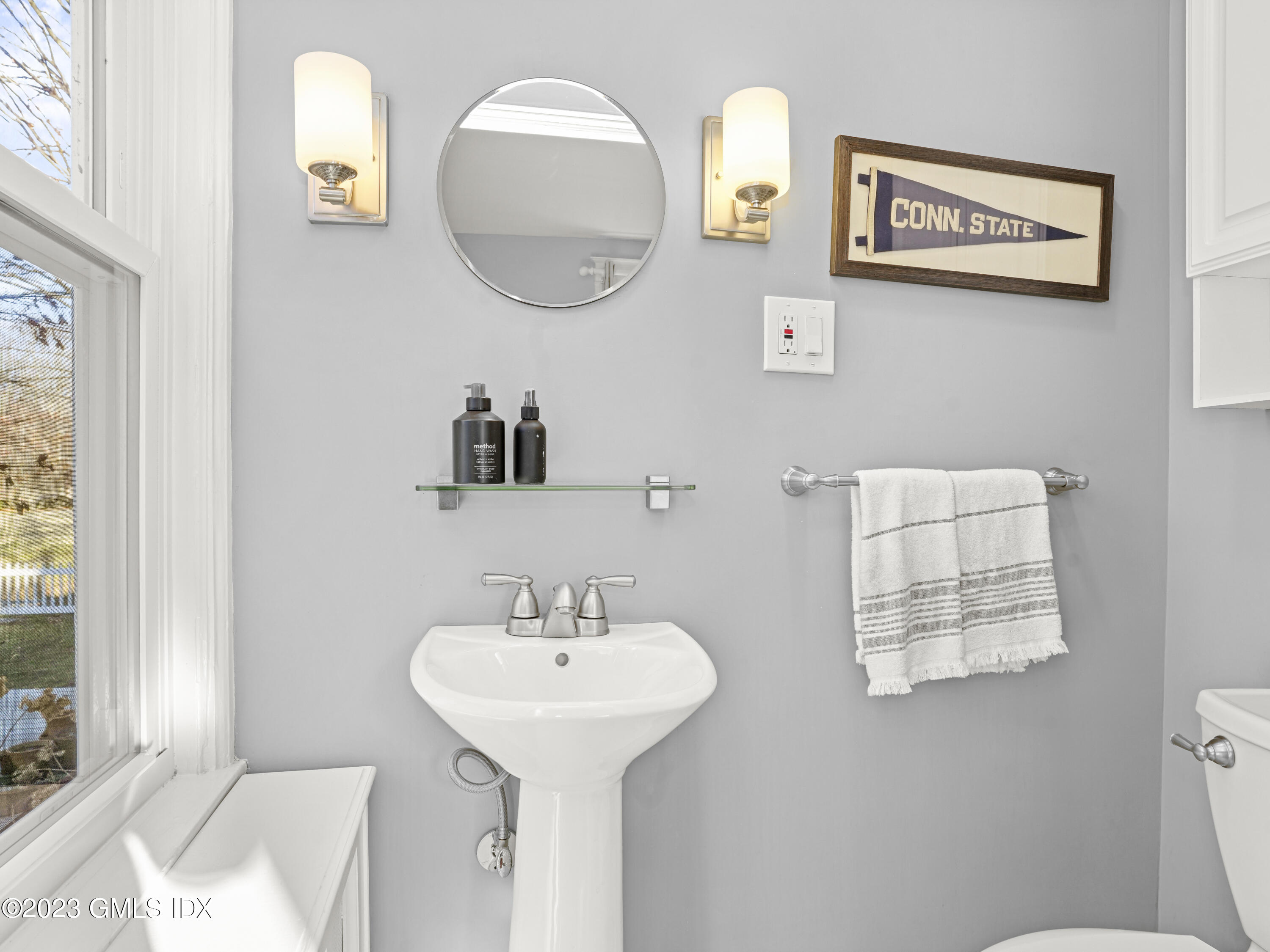 15 Locust Road, Unit COTTAGE Greenwich, CT 06831 - Photo 9 of 25 a bathroom with a sink and a mirror