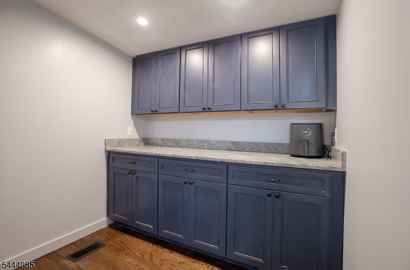 79 Lake Wallkill Road Vernon, NJ 07461 - Photo 6 of 27 a kitchen with granite countertop wooden cabinets and a sink