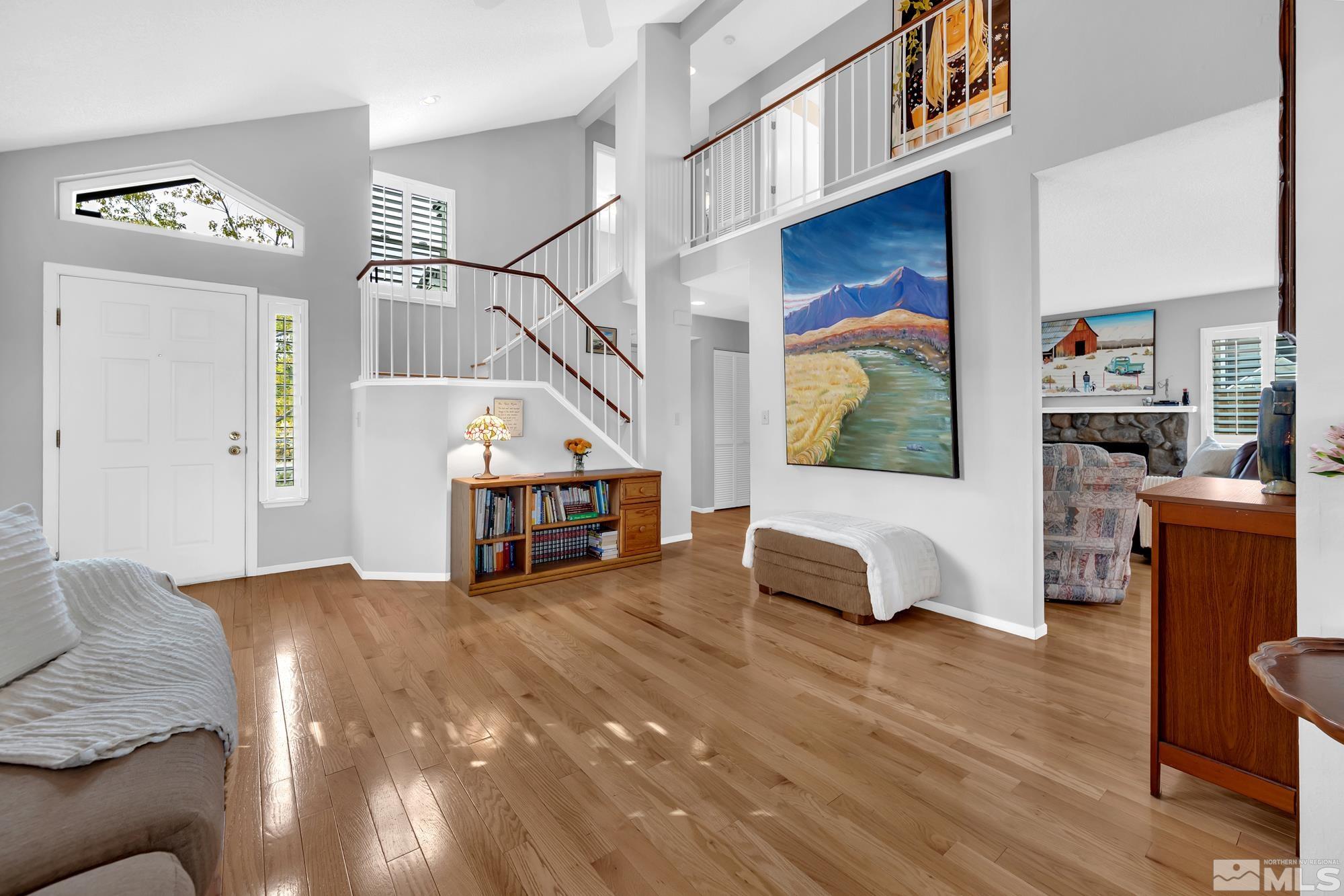 5861 Bankside Way Reno, NV 89523 - Photo 2 of 39 a living room with furniture and a stairs