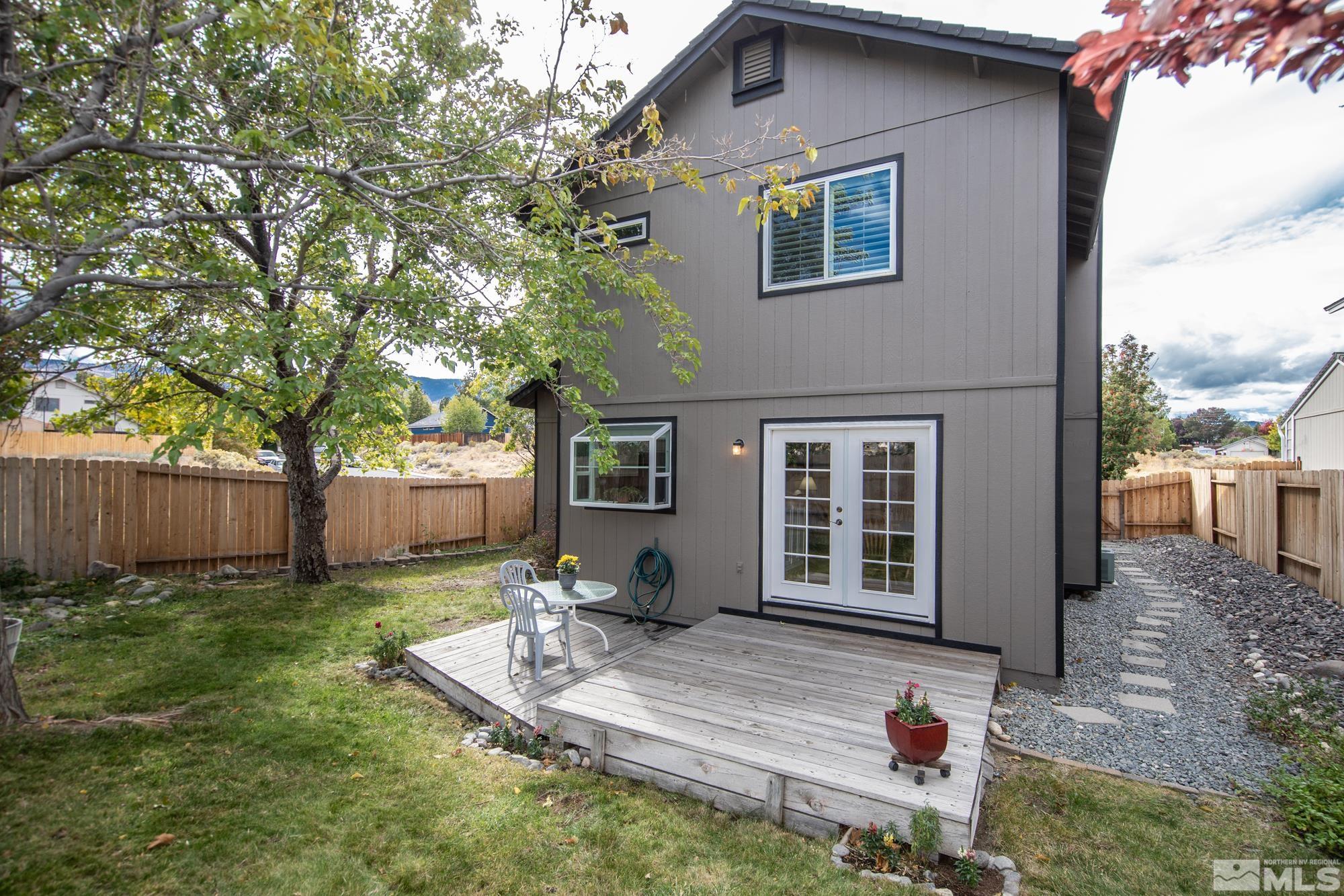 5861 Bankside Way Reno, NV 89523 - Photo 30 of 39 a front view of a house with garden