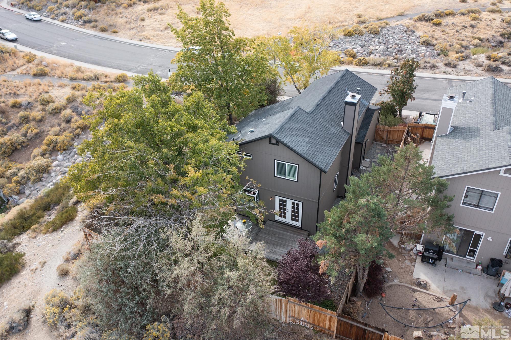 5861 Bankside Way Reno, NV 89523 - Photo 36 of 39 an aerial view of a house with a yard and lake view