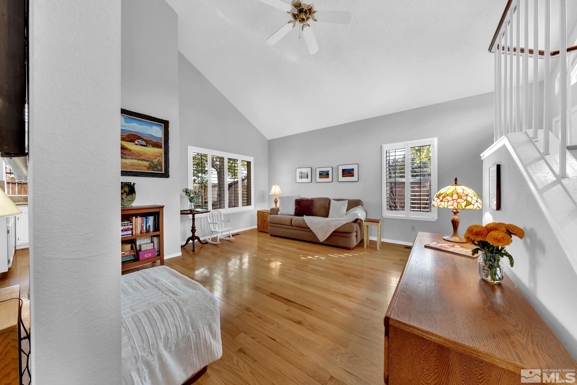 5861 Bankside Way Reno, NV 89523 - Photo 5 of 39 a bedroom with furniture and a wooden floor