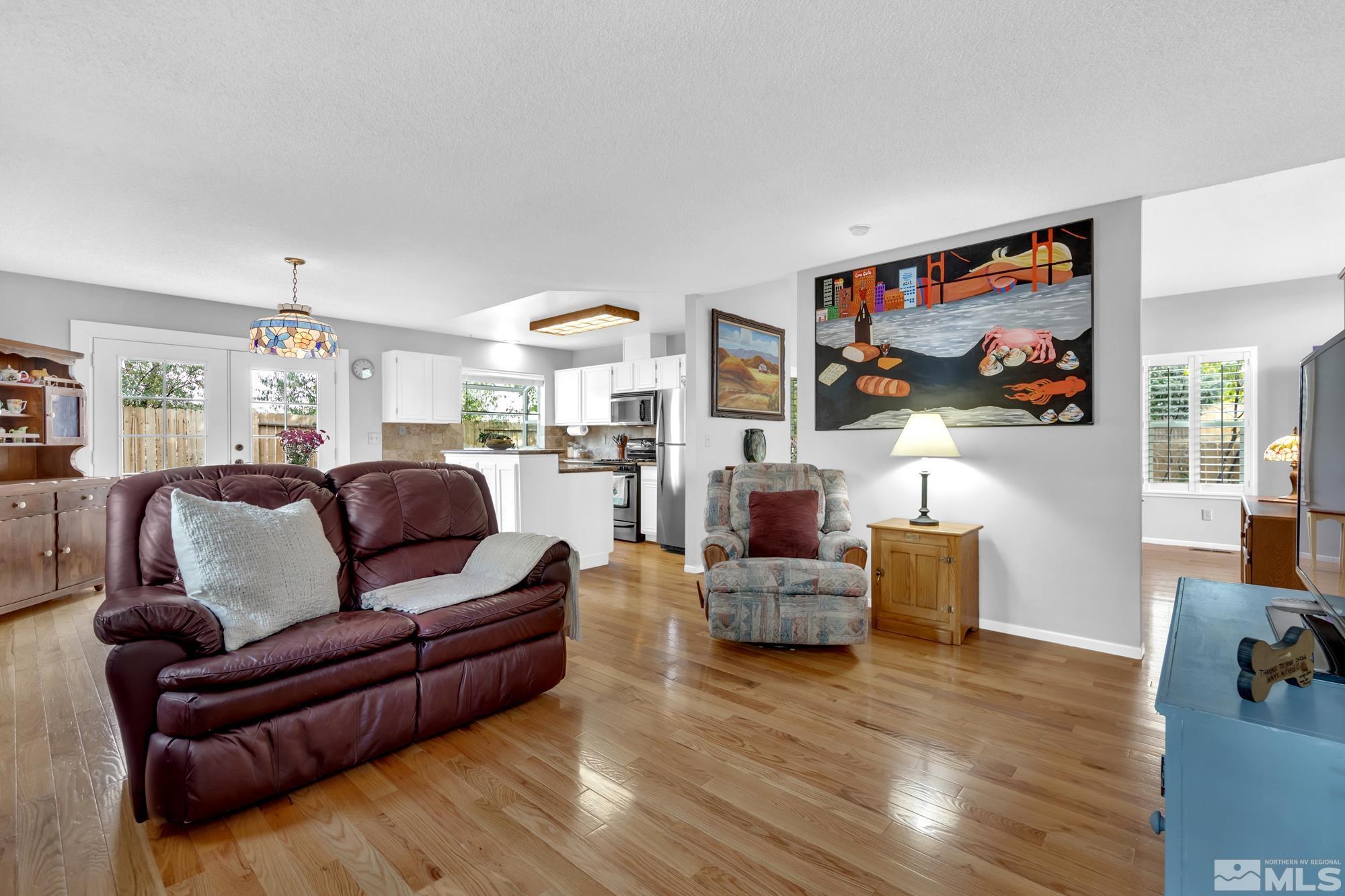 5861 Bankside Way Reno, NV 89523 - Photo 7 of 39 a living room with fireplace furniture and a flat screen tv