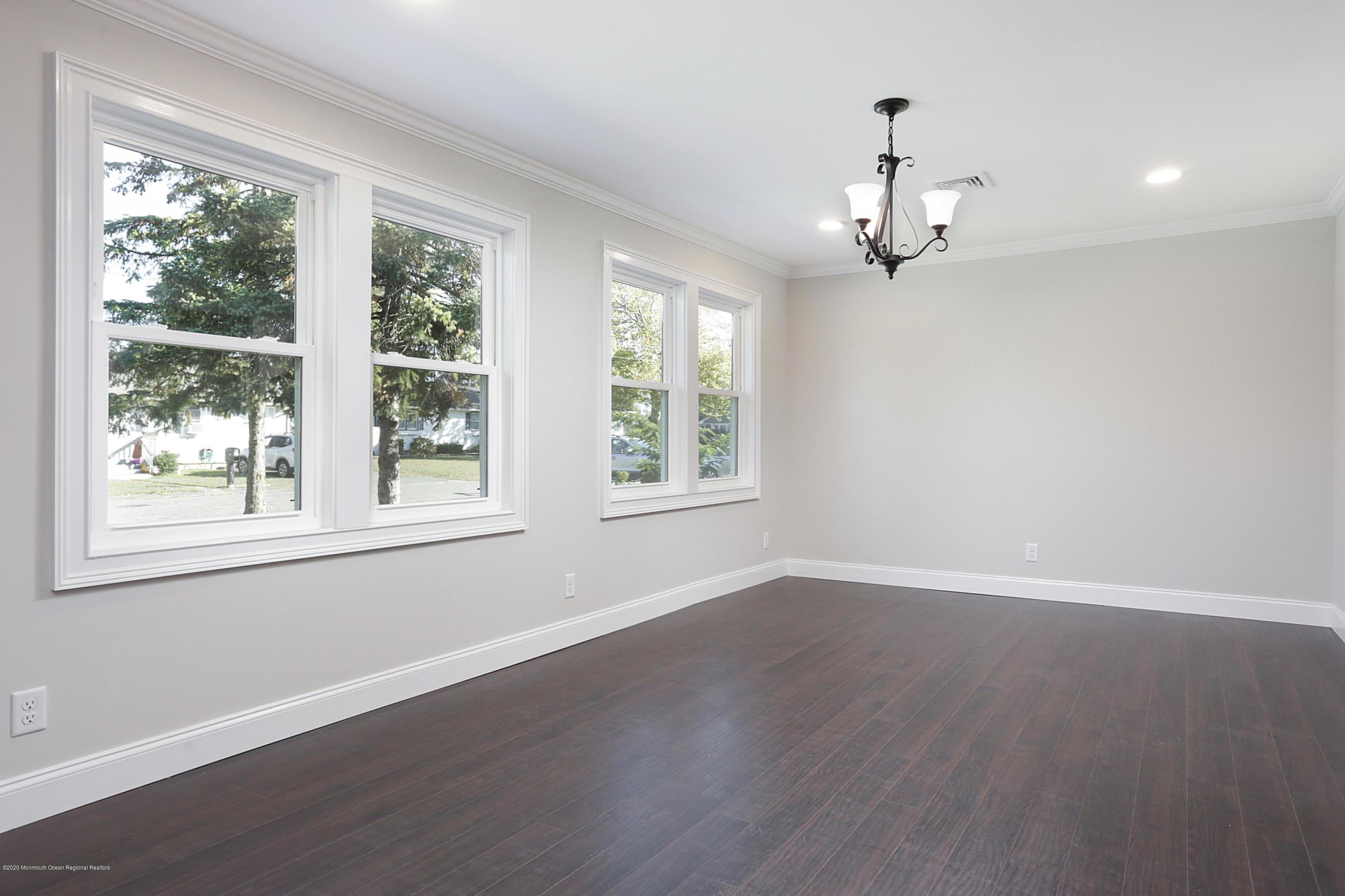 715 Pine Drive Brick, NJ 08723 - Photo 16 of 41 wooden floor in an empty room with a window