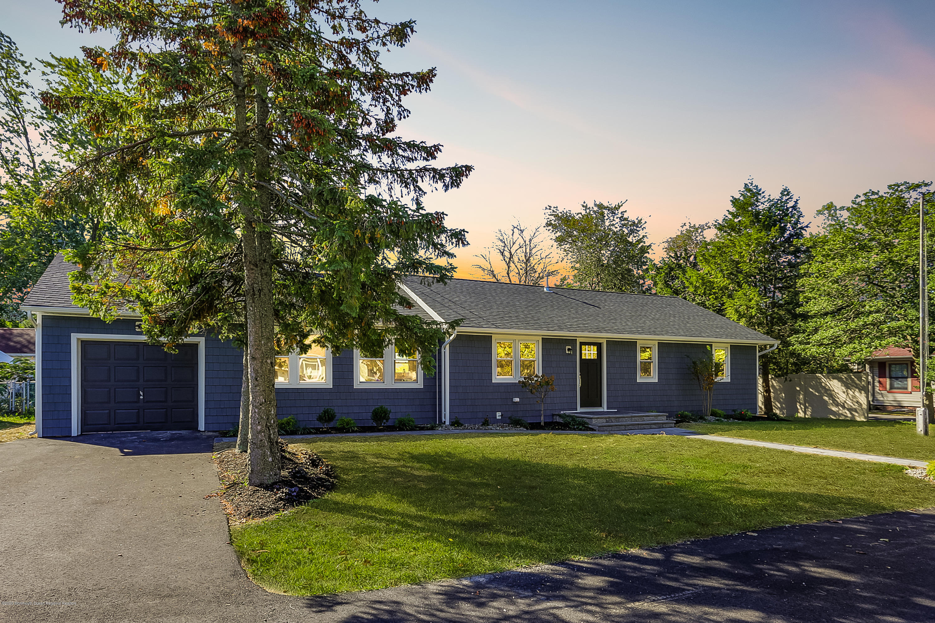 715 Pine Drive Brick, NJ 08723 - Photo 3 of 41 a front view of a house with a garden