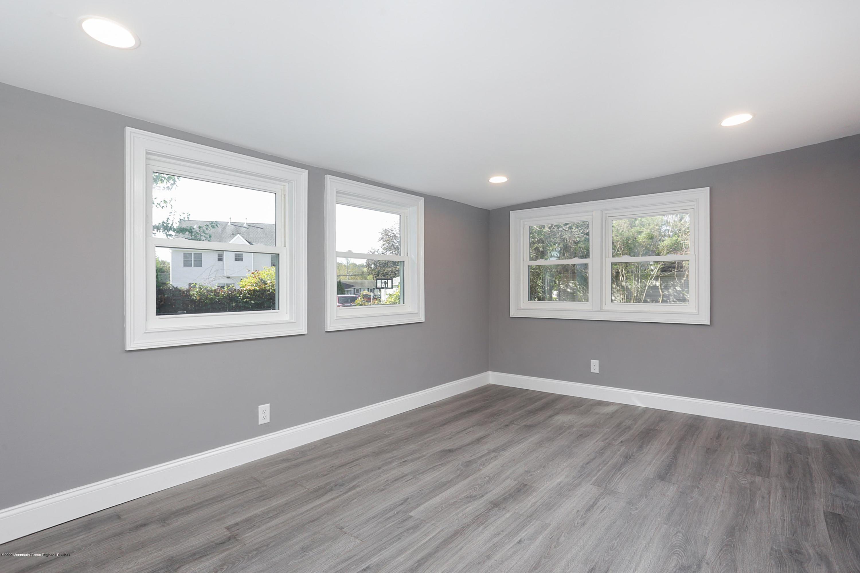 715 Pine Drive Brick, NJ 08723 - Photo 24 of 41 a view of room with window and wooden floor