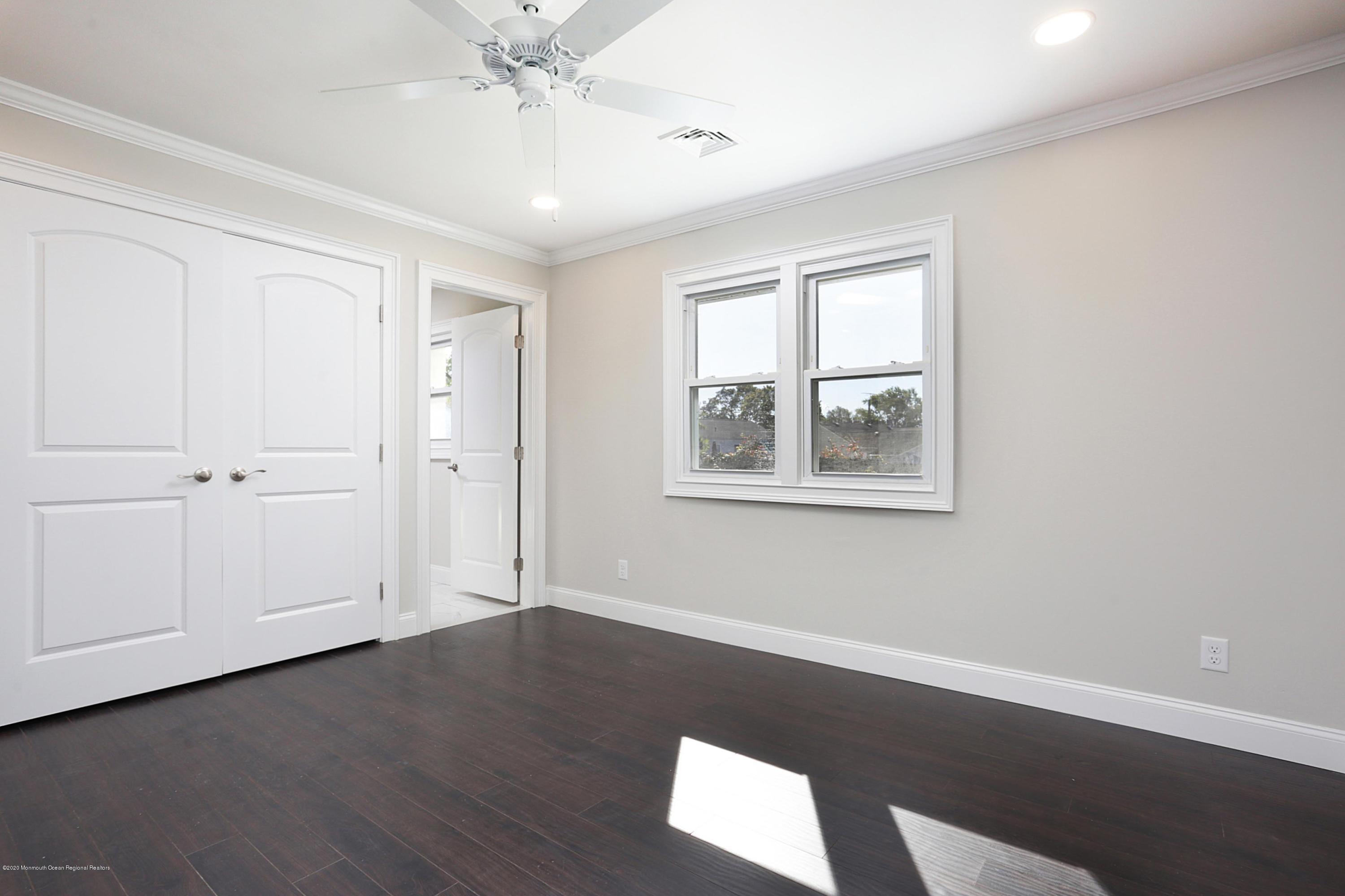 715 Pine Drive Brick, NJ 08723 - Photo 27 of 41 wooden floor in an empty room with a window