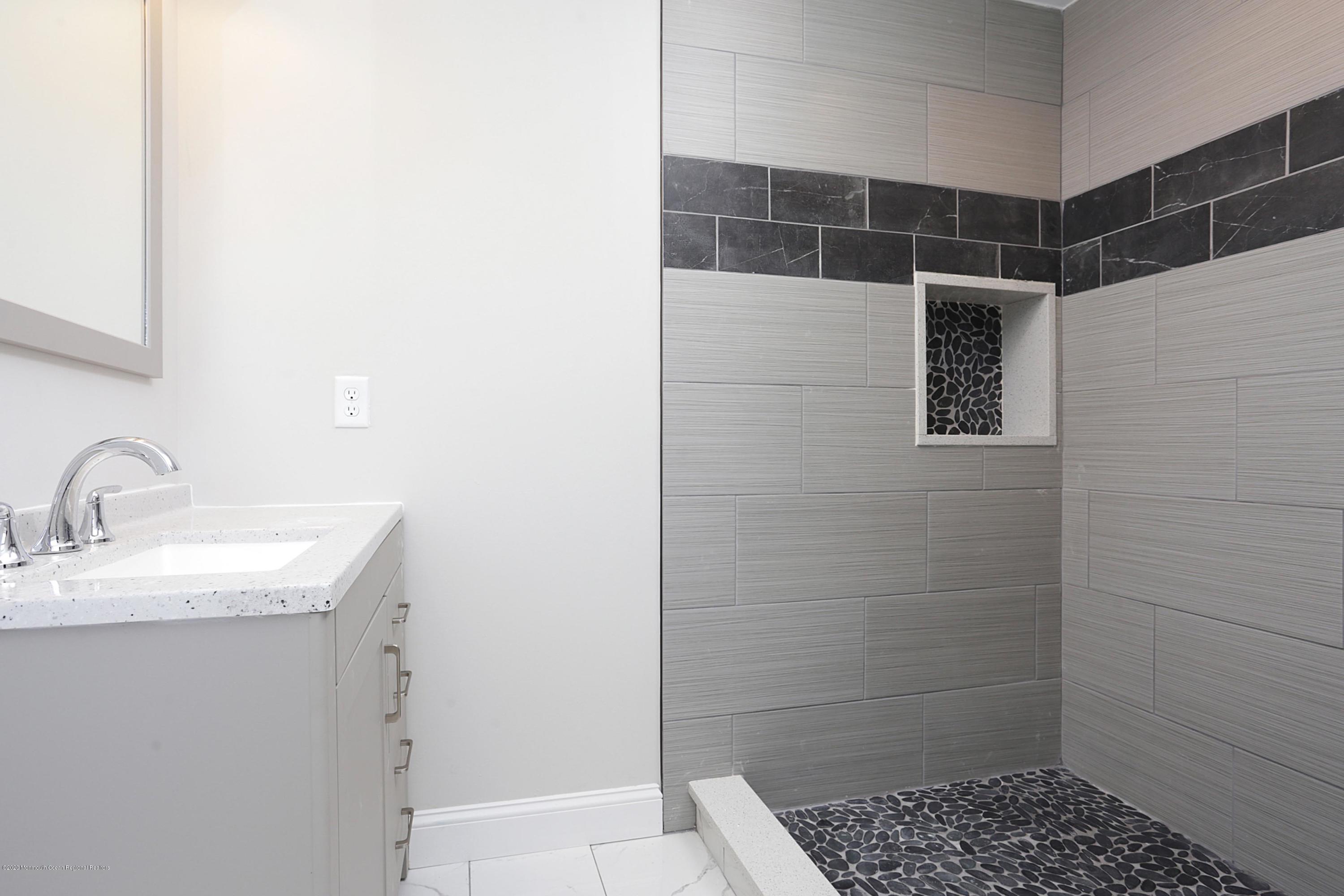 715 Pine Drive Brick, NJ 08723 - Photo 28 of 41 a bathroom with a sink toilet and shower