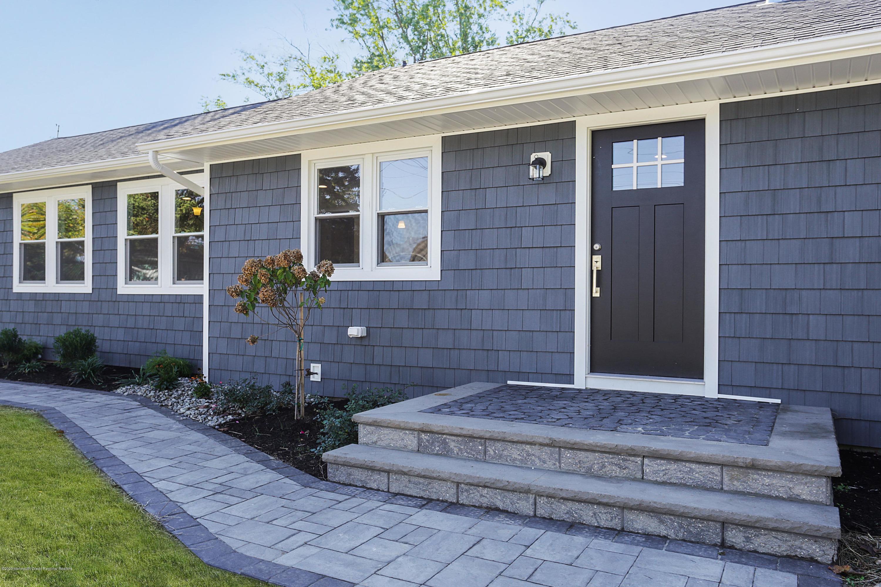 715 Pine Drive Brick, NJ 08723 - Photo 4 of 41 a front view of a house with garden