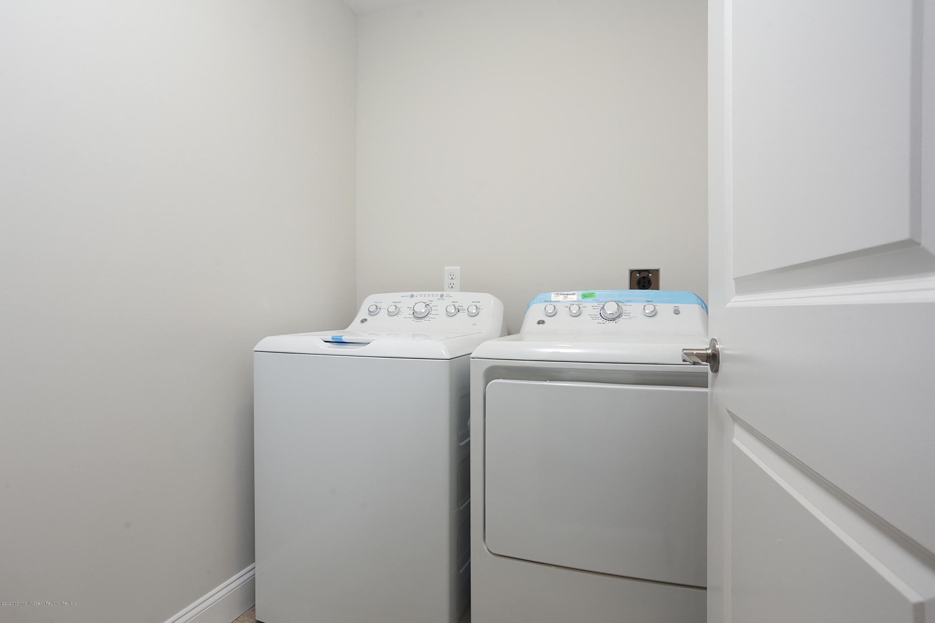 715 Pine Drive Brick, NJ 08723 - Photo 31 of 41 a utility room with dryer and washer