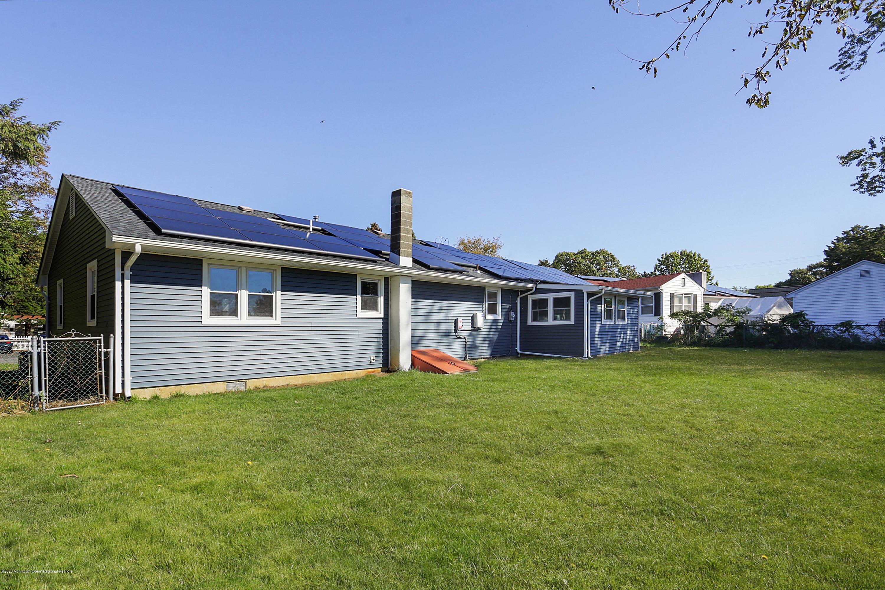 715 Pine Drive Brick, NJ 08723 - Photo 39 of 41 a front view of a house with a garden