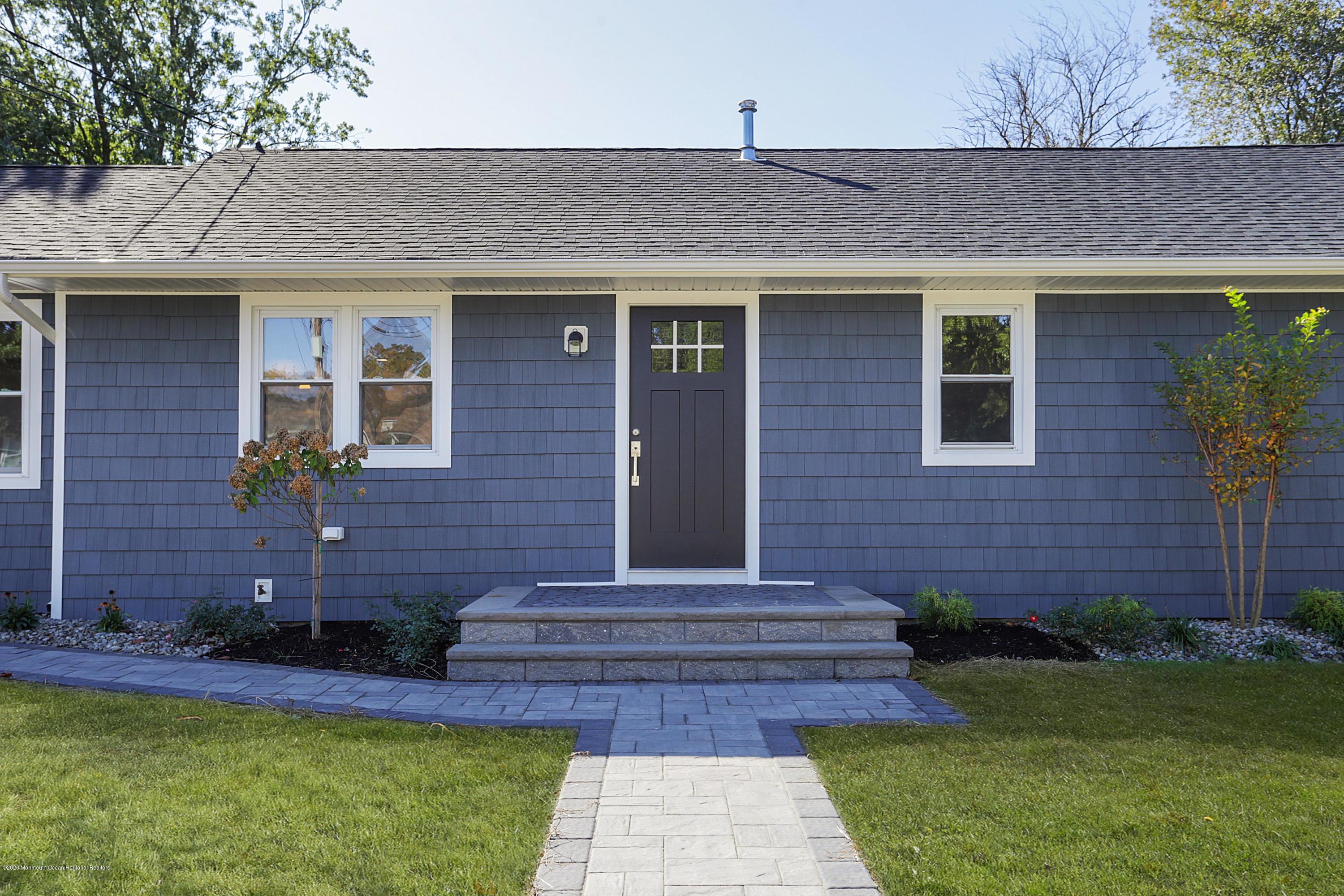715 Pine Drive Brick, NJ 08723 - Photo 5 of 41 a front view of a house with garden
