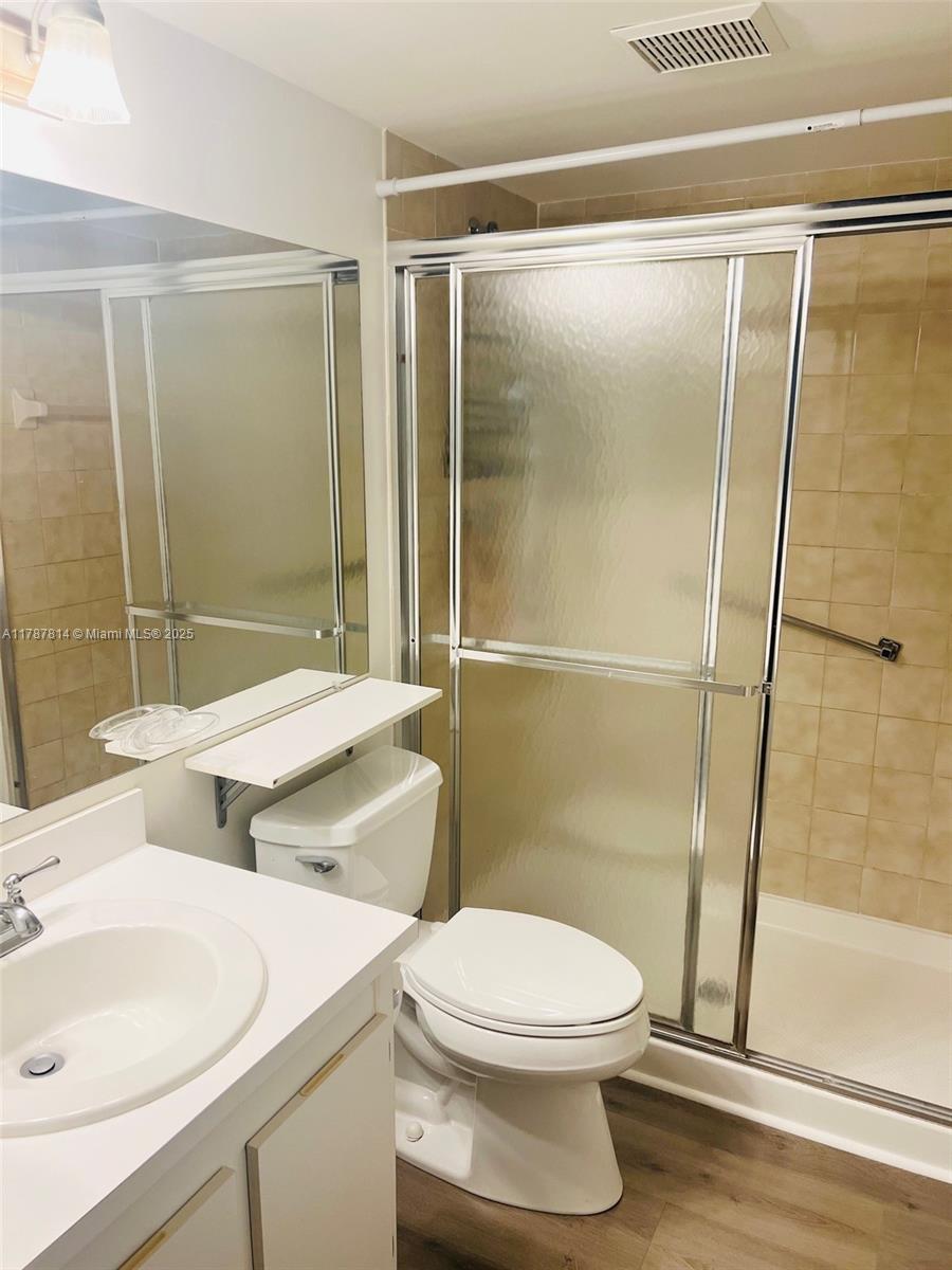 819 Sky Pine Way, Unit D3 Greenacres, FL 33415 - Photo 4 of 11 a bathroom with a sink and a mirror