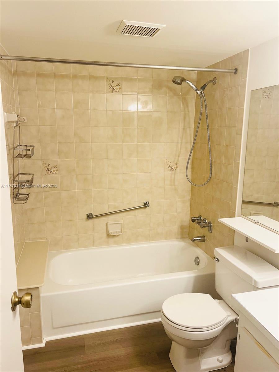 819 Sky Pine Way, Unit D3 Greenacres, FL 33415 - Photo 5 of 11 a bathroom with a shower and a toilet