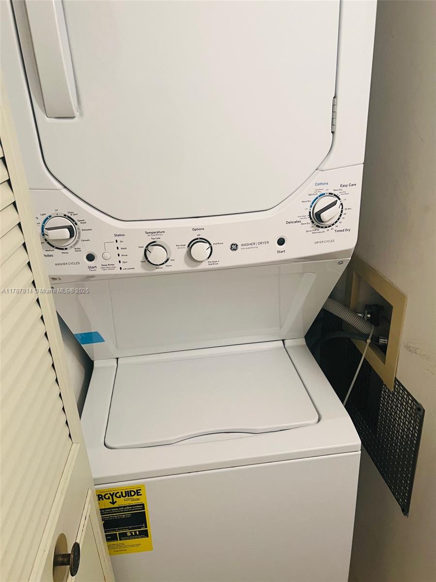 819 Sky Pine Way, Unit D3 Greenacres, FL 33415 - Photo 7 of 11 a utility room with dryer and washer