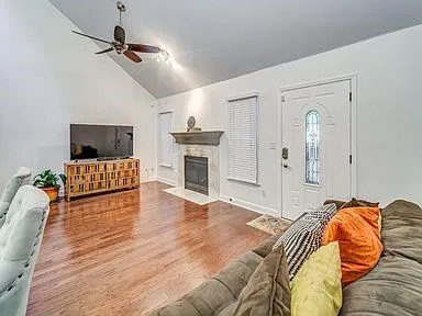 a bedroom with furniture and a fireplace