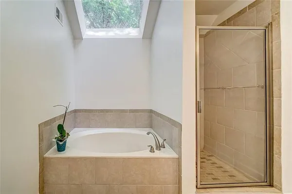 a bath tub sitting next to a window