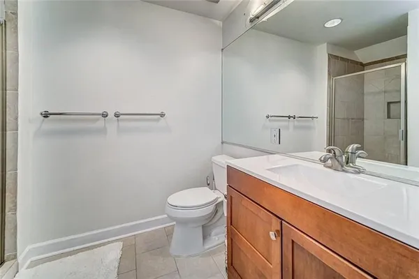 a bathroom with a sink toilet and vanity