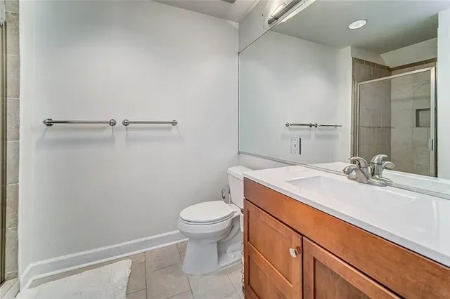 a bathroom with a sink toilet and vanity