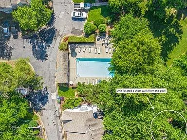 a sign that is sitting in front of flowers