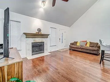 a living room with furniture and a fireplace