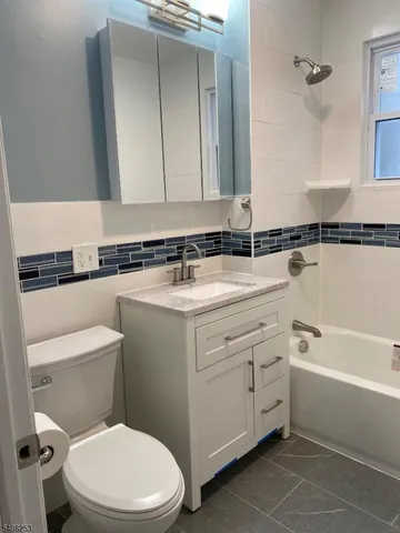 a bathroom with a shower and a bathtub