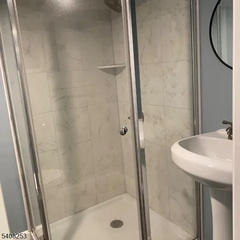 a view of a kitchen with microwave and cabinets