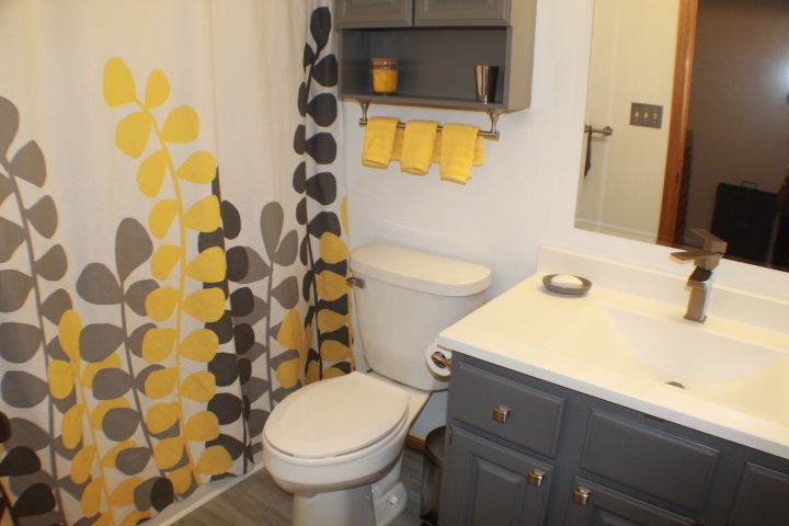 4241 Gloucester Road Roscoe, IL 61073 - Photo 19 of 50 a bathroom with a sink toilet and shower