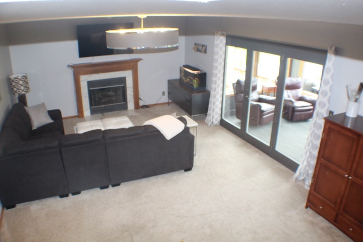4241 Gloucester Road Roscoe, IL 61073 - Photo 23 of 50 a bedroom with furniture and a fireplace