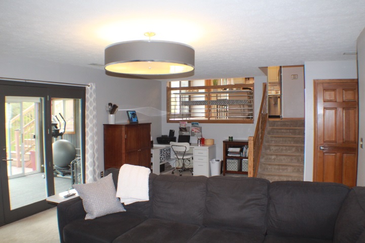 4241 Gloucester Road Roscoe, IL 61073 - Photo 24 of 50 a view of a dining room with furniture a chandelier and wooden floor