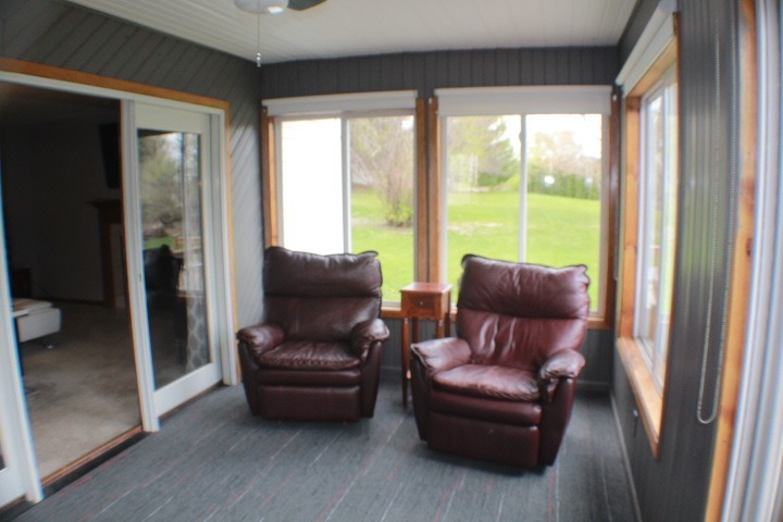 4241 Gloucester Road Roscoe, IL 61073 - Photo 25 of 50 a living room with furniture and a large window