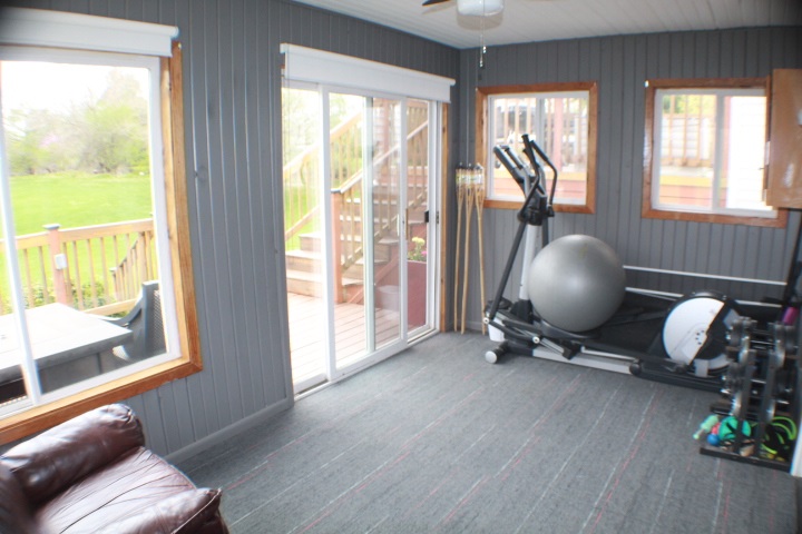 4241 Gloucester Road Roscoe, IL 61073 - Photo 26 of 50 a room with wooden floor and windows