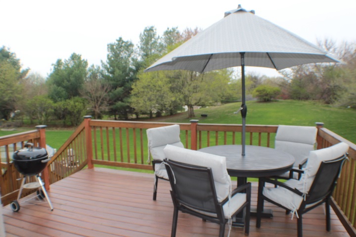 4241 Gloucester Road Roscoe, IL 61073 - Photo 36 of 50 a view of deck with furniture and a garden