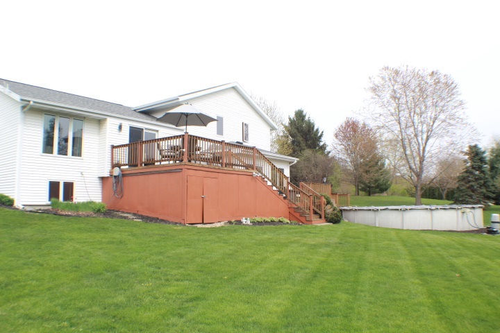 4241 Gloucester Road Roscoe, IL 61073 - Photo 39 of 50 a view of a house with a yard and sitting area