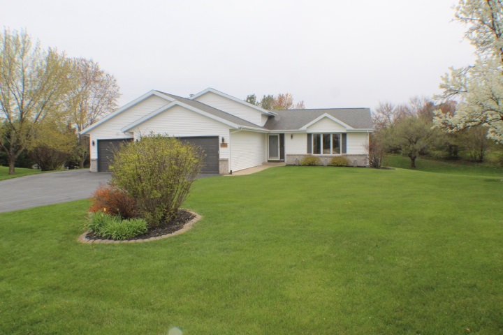 4241 Gloucester Road Roscoe, IL 61073 - Photo 42 of 50 a front view of a house with a yard and garage