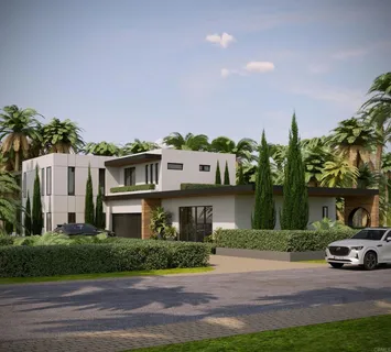 a front view of a house with a garden and a yard