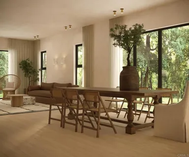 a view of a dining room with furniture window and outside view