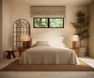 a bedroom with a large bed and a window
