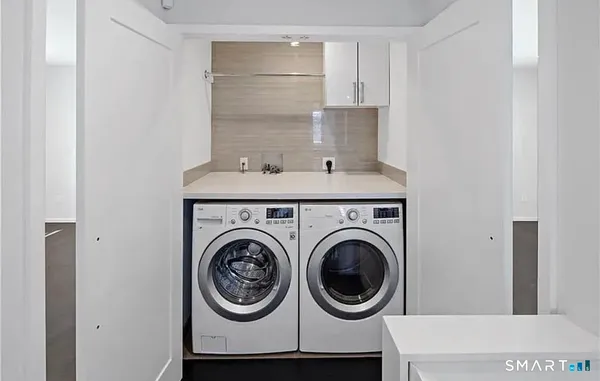 a utility room with dryer and washer