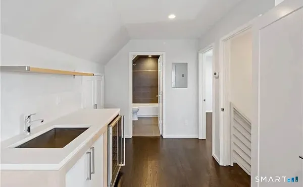 a kitchen with a sink and a refrigerator
