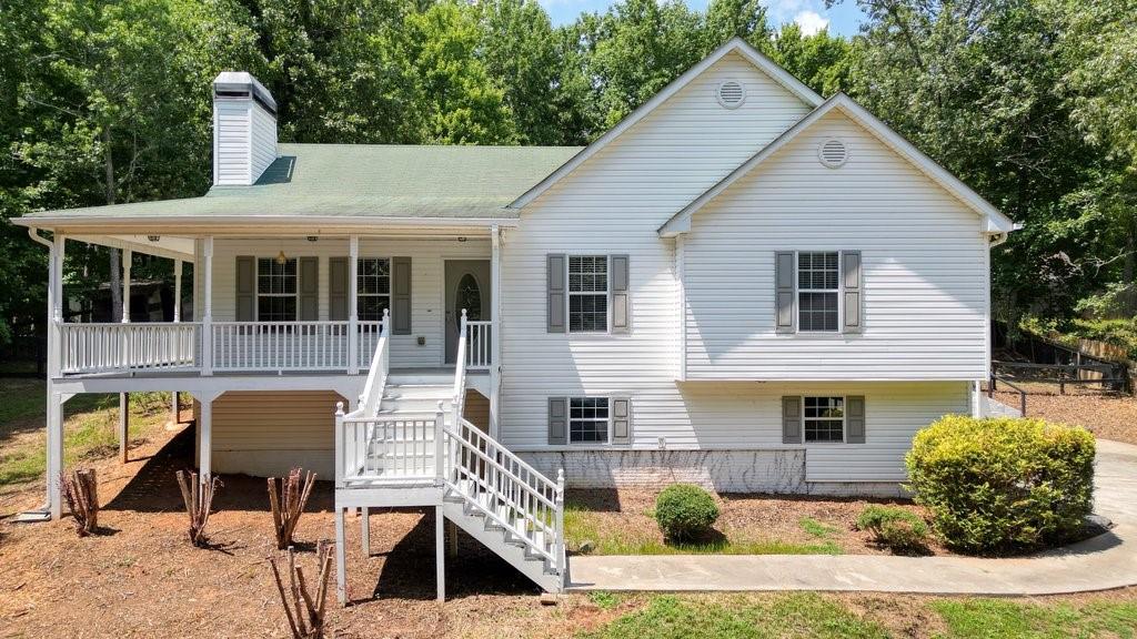 485 Cable Road Waleska, GA 30183 - Photo 1 of 1 a front view of a house with garden