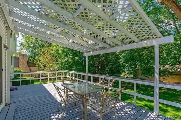 35882 Smithfield Road Farmington, MI 48335 - Photo 34 of 43 Oversized deck with pergola looks out onto serene backyard