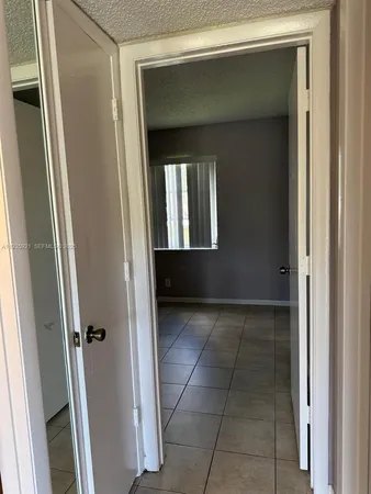 a kitchen with a refrigerator and a stove