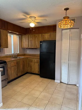 a kitchen with stainless steel appliances a refrigerator and a sink