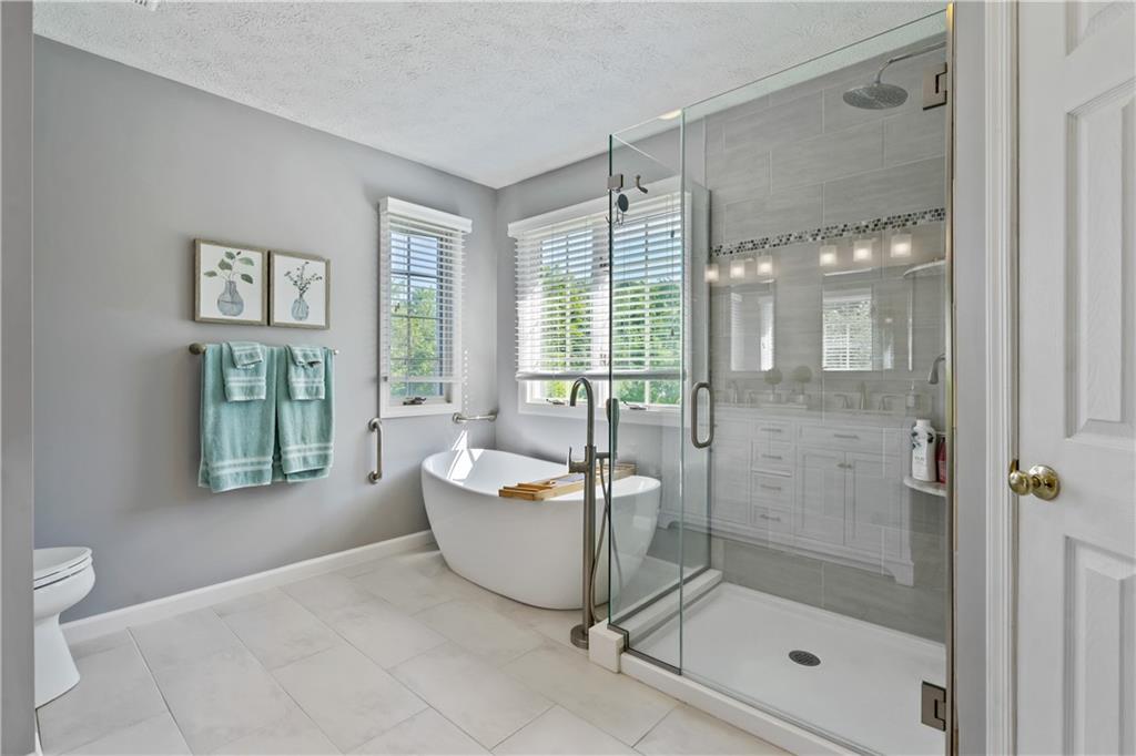 104 Field Club Circle McKees Rocks, PA 15136 - Photo 11 of 25 a bathroom with a bathtub and a shower
