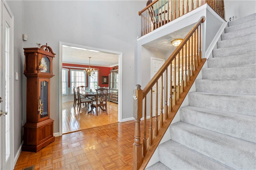 104 Field Club Circle McKees Rocks, PA 15136 - Photo 3 of 25 a view of staircase with dining table and chairs