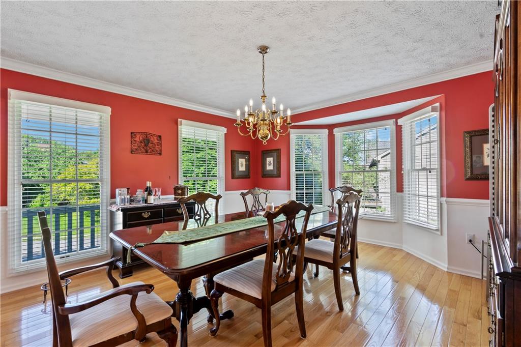 104 Field Club Circle McKees Rocks, PA 15136 - Photo 8 of 25 a view of a dining room with furniture window and wooden floor